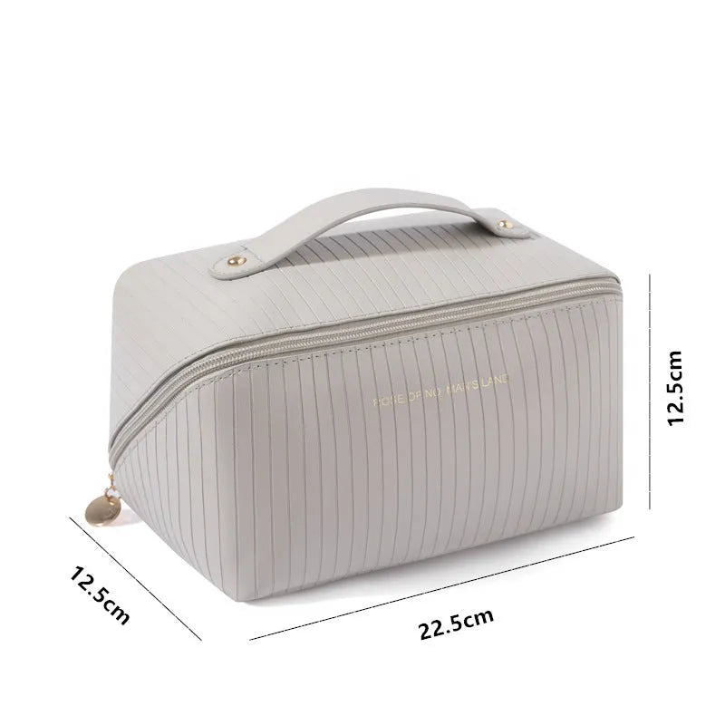 Beige cubic makeup bag with vertical pattern design showing 22.5cm height, 12.5cm width dimensions