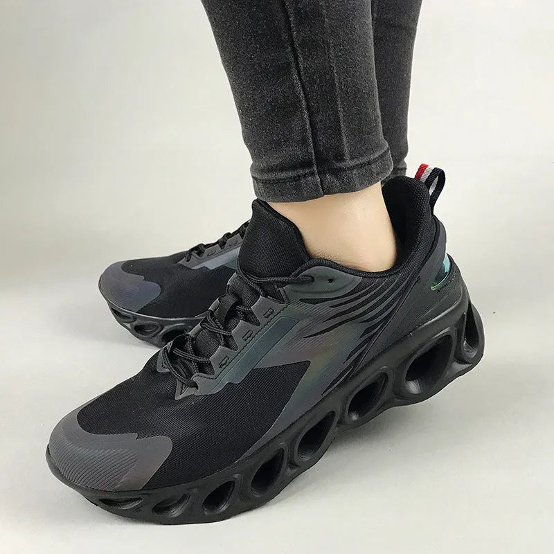 Low-top breathable trainers in dark blue with mesh upper and lace-up front, showing EVA sole and round toe design.