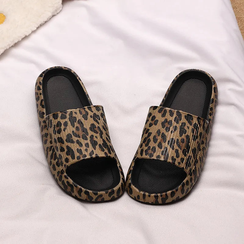 Leopard print slippers with thick EVA sole showing slip-on design and animal pattern details