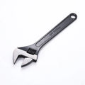 Stainless steel adjustable wrench with blackening treatment, ergonomic handle, and adjustable jaw for bolts up to 49mm