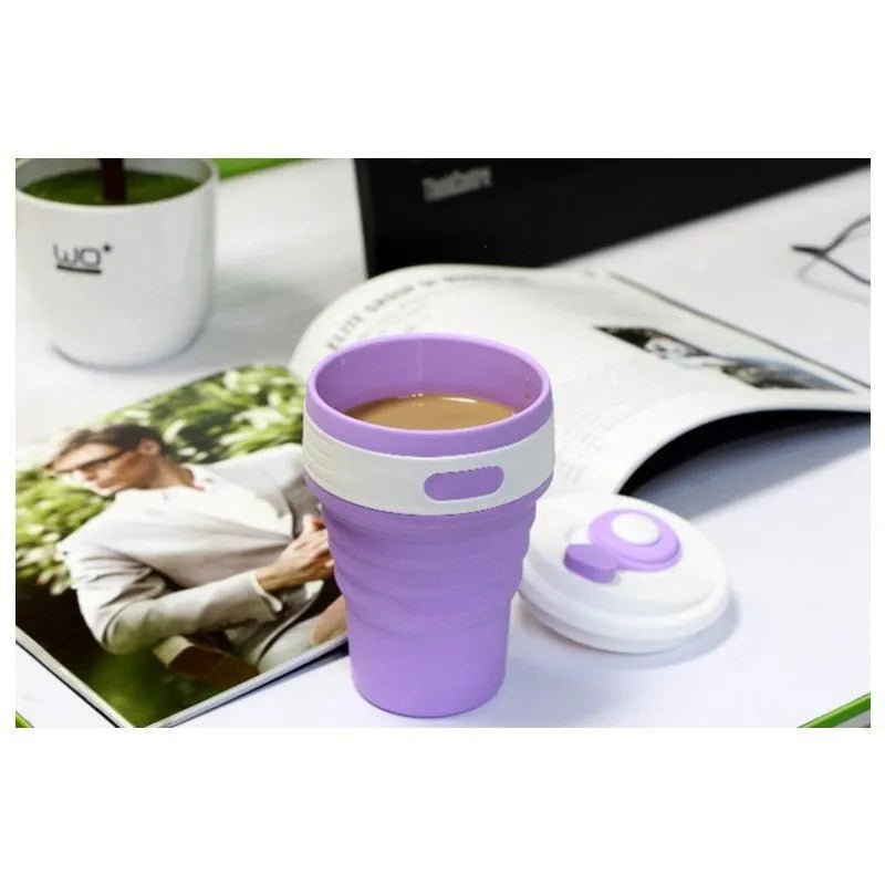 Green collapsible silicone travel cup folded to 6cm height next to expanded 350ml version with leak-proof cover
