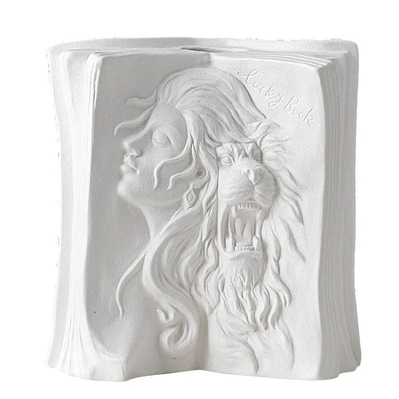 Ceramic book stand in lover design with glazed surface, approximately 15cm tall, on a wooden desk