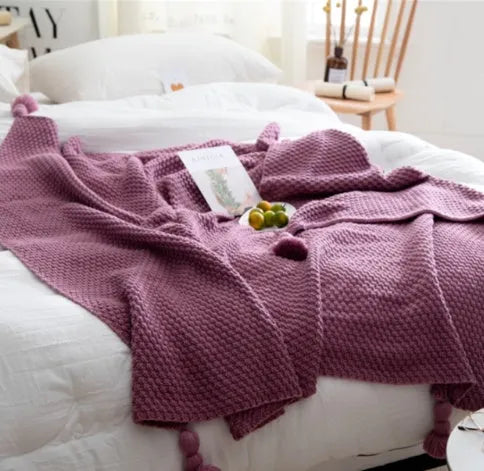 Nordic style acrylic knit blanket with ball fringe, shown in beige, dimensions 130 by 170 cm.