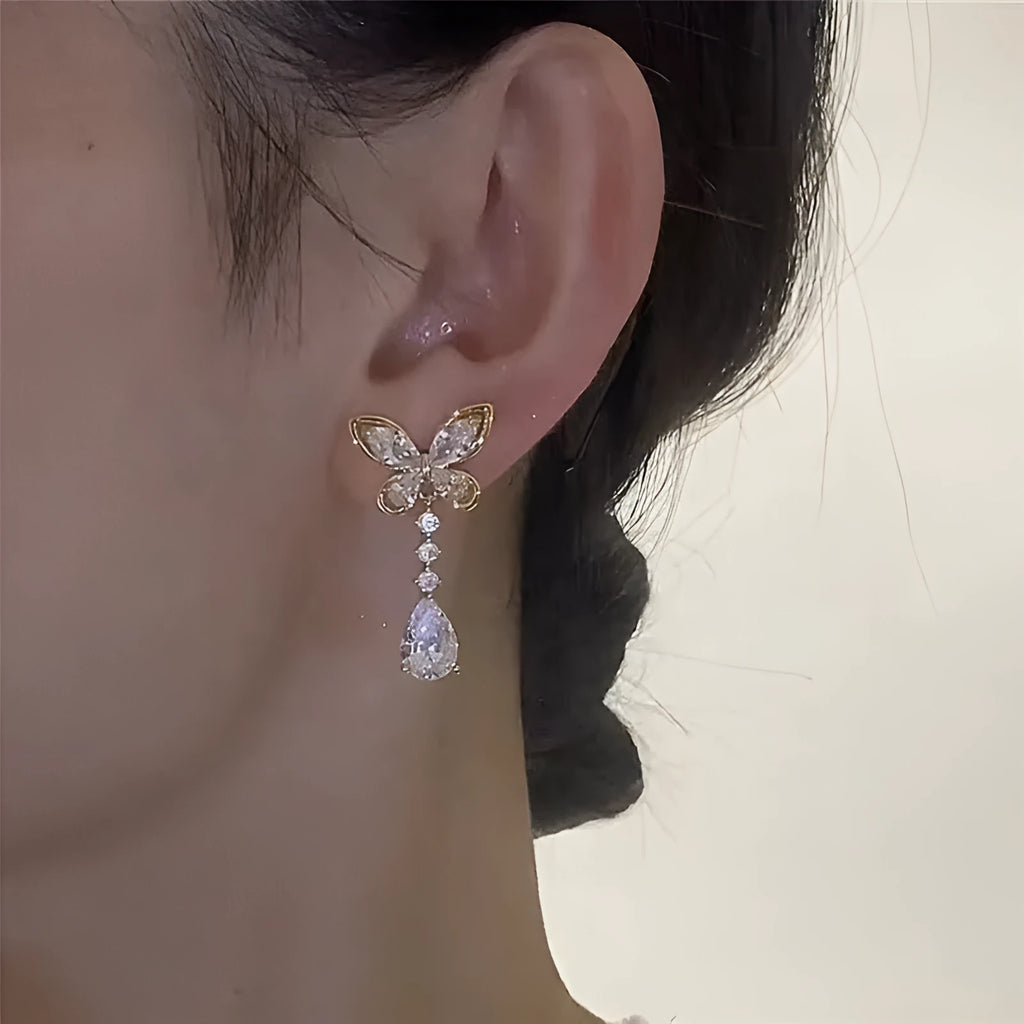 Women's bow-shaped stud earrings with platinum colour electroplated finish on zinc alloy