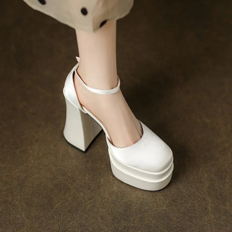 Women's white waterproof platform pumps with a chunky heel and round toe
