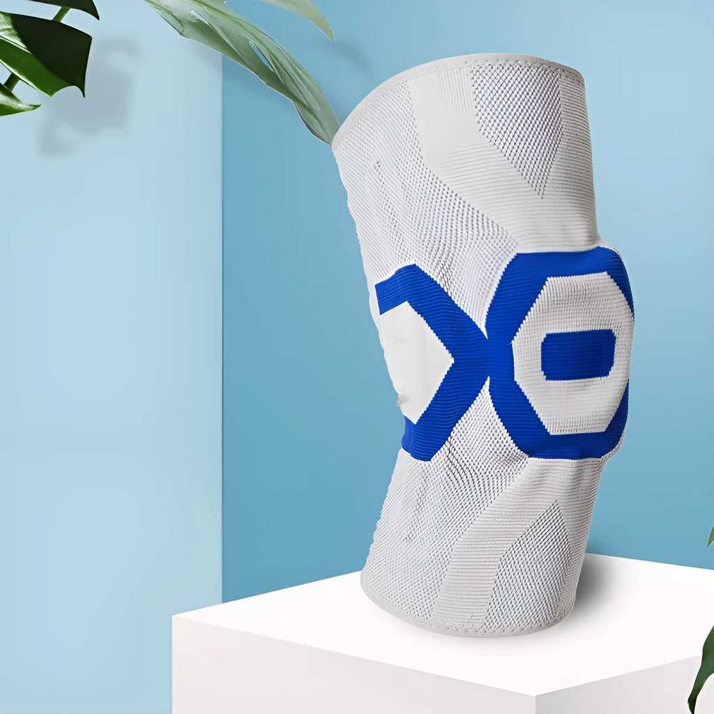 A silicone knee pad for men in a black and blue colour scheme, shown from the side.