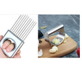 Stainless steel kitchen tool set including an onion fork and a garlic press on a kitchen counter.