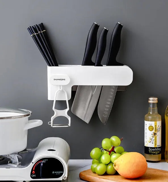 Modern white plastic kitchen knife rack with non-slip strip for wall or drawer mounting.