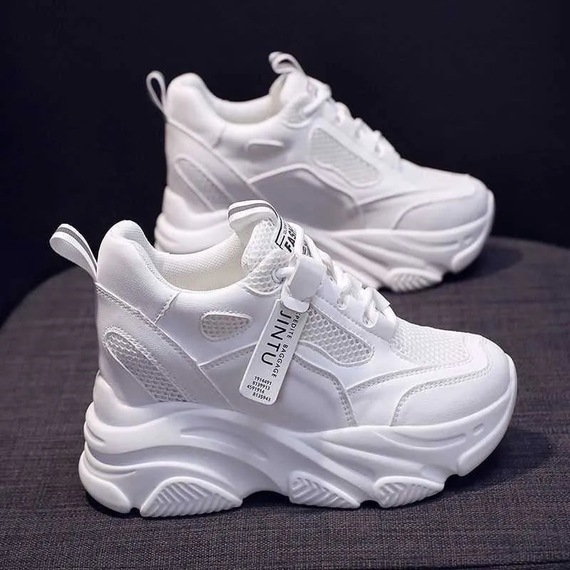 Women's black casual platform shoes with mesh upper, toe holder detail, and hollow-out design on a white background.