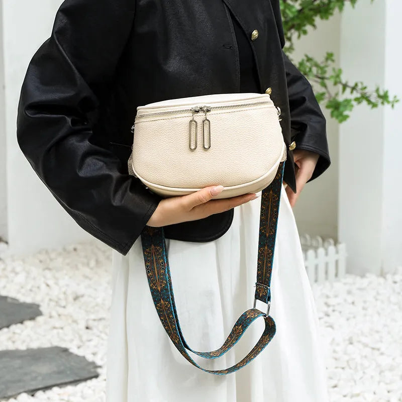 Women's soft PU messenger bag in saddle shape with single strap and zipper changing bag, available in black, white, green.