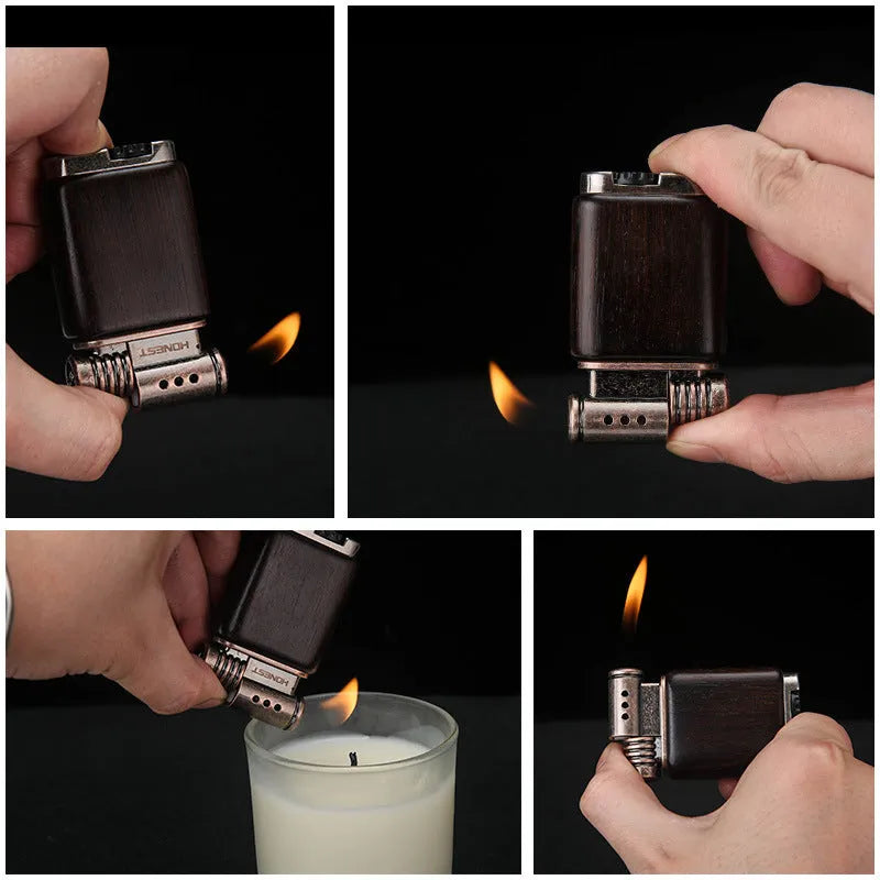 Ebony gas lighter with black wood body and rosewood decorative accents including sun surface and good luck designs