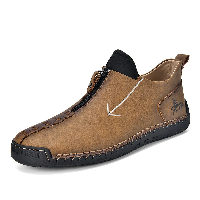 Men's black leather boots with front zipper, hand-stitched sole, and mid-calf length