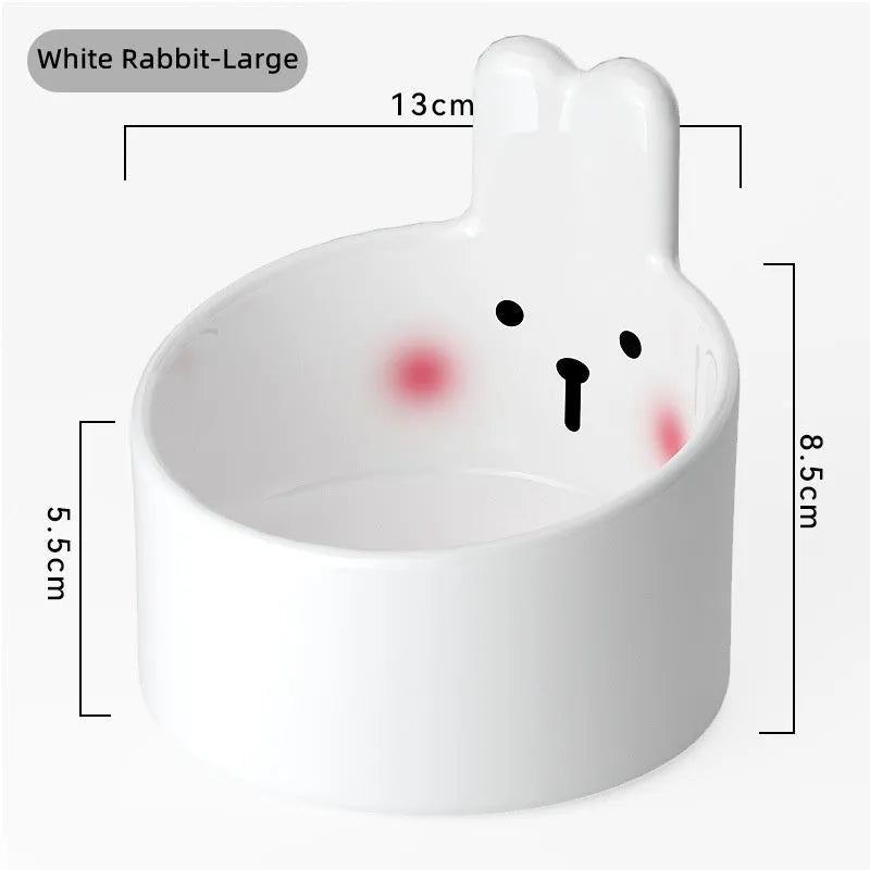 Ceramic pet bowl with neck guard design in white rabbit pattern, shown next to a large brown bear pattern bowl.