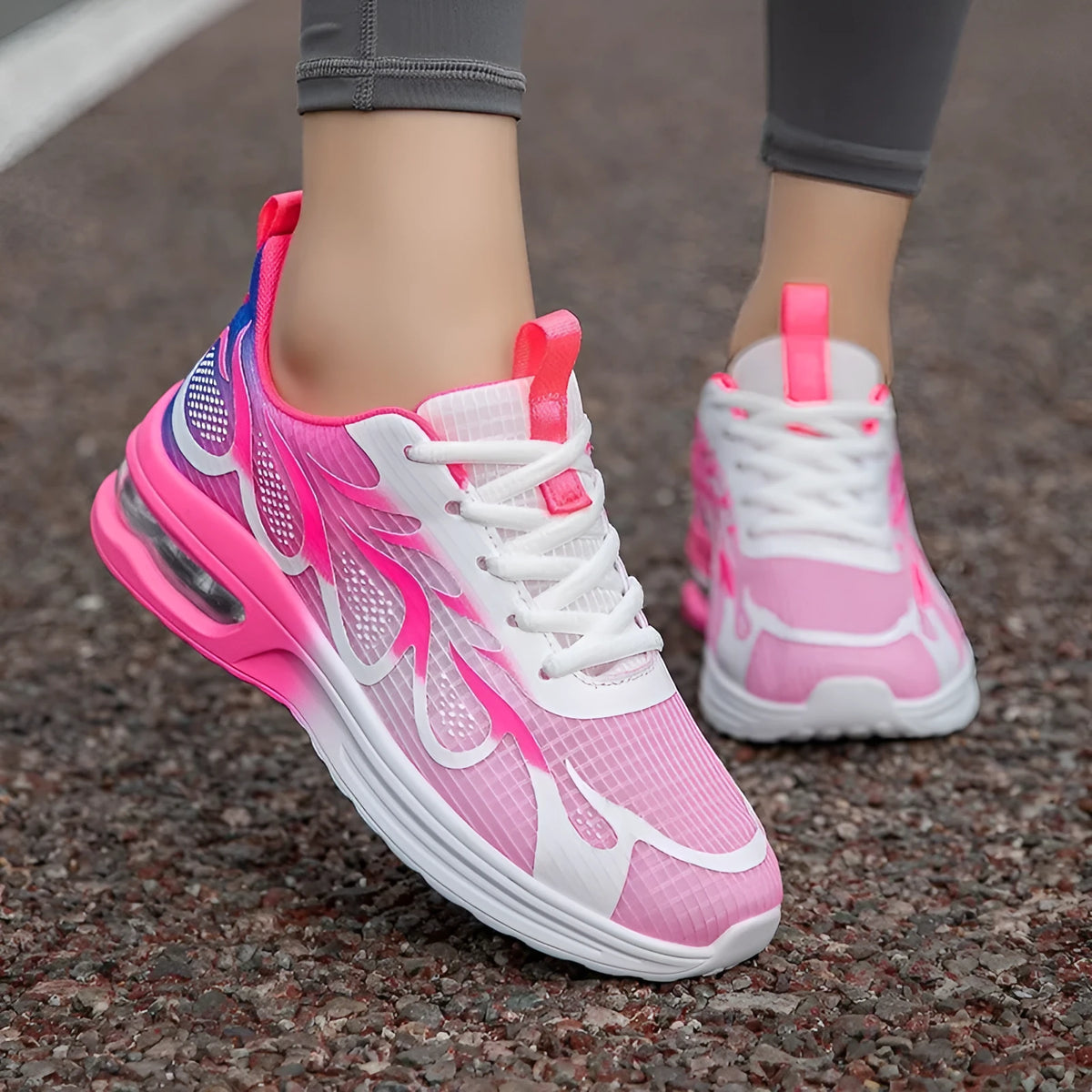Women's pink mesh casual sneaker with lace-up front and light-coloured PU sole.
