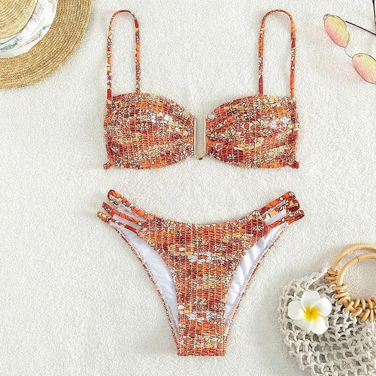 Women's floral high-waist bikini swimsuit set in solid blue colour with matching bra.