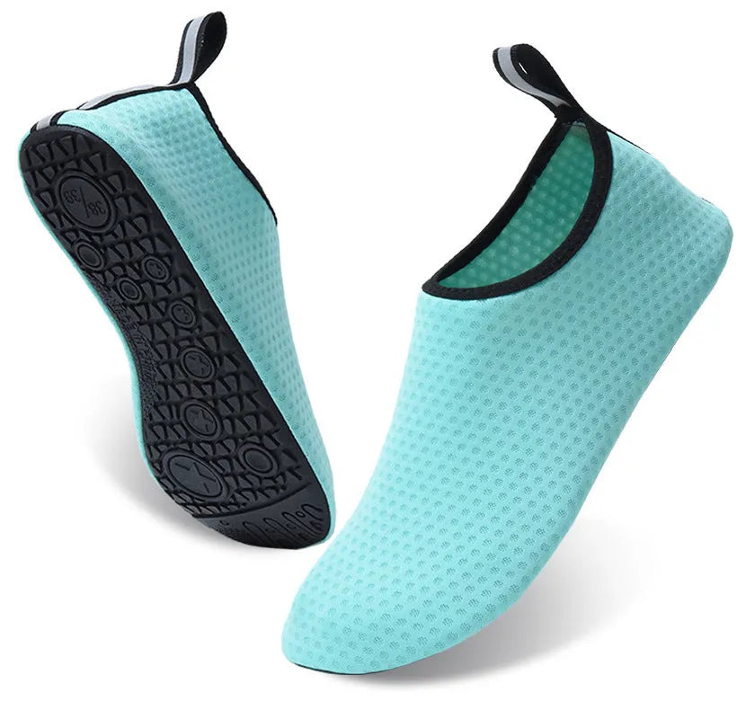 A pair of casual low-top beach shoes with a mesh upper, elastic band, and non-slip TPR outsole.