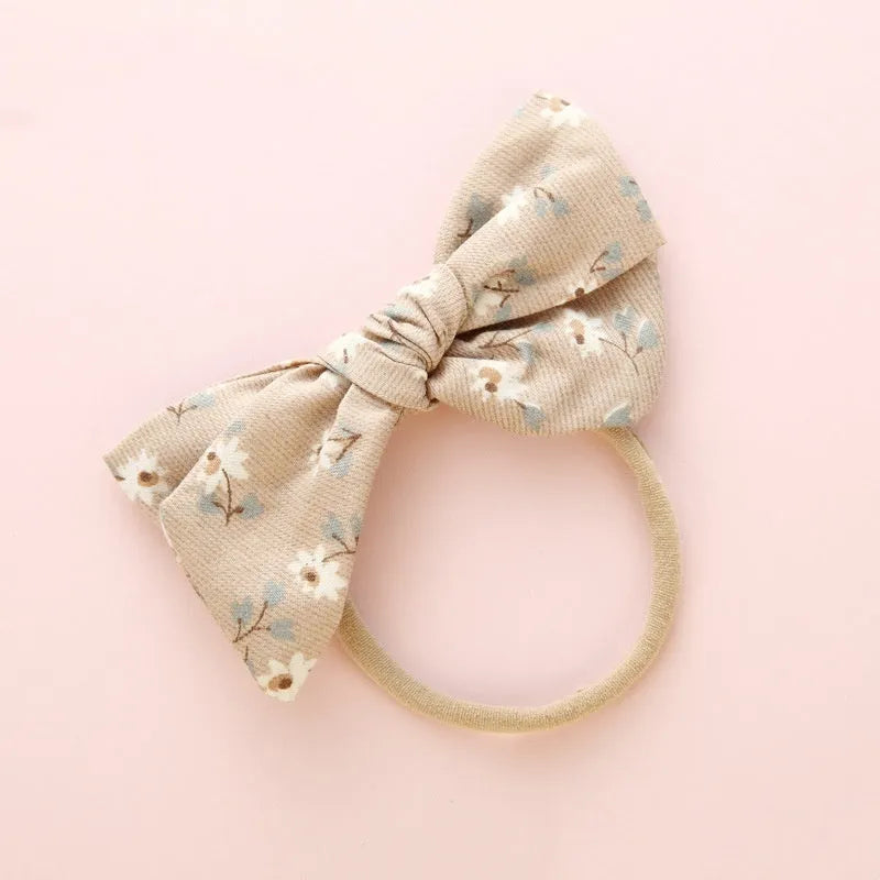 Children's cloth knotted bow hair ring in a Snow White princess print.
