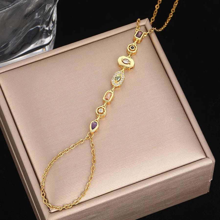 Titanium steel tassel rhinestone finger chain bracelet in drop shape, gold or silver colour options