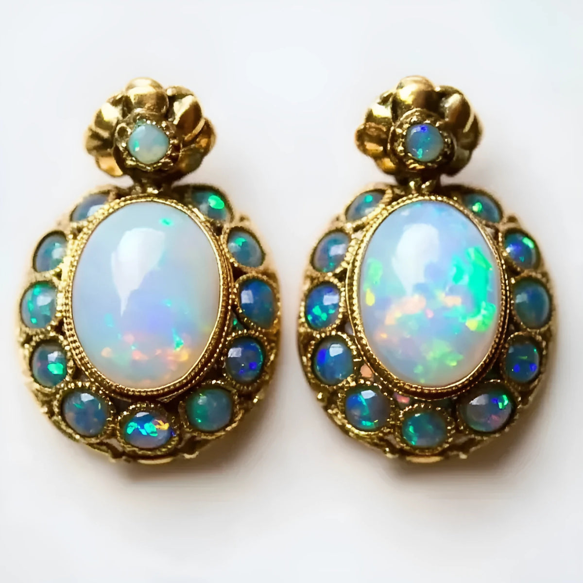Gold-colour coloured gems earrings with geometric sunflower shape and inlaid gem setting, one pair