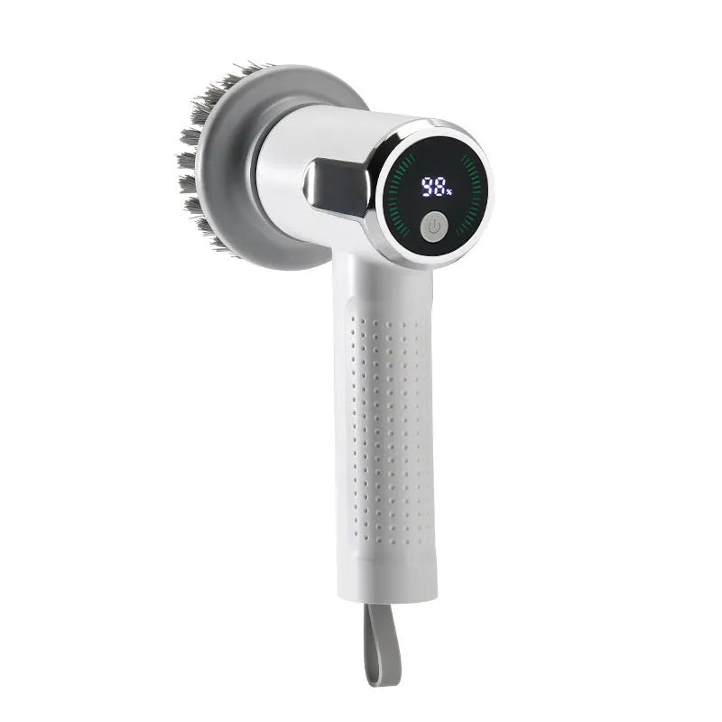 White wireless electric cleaning brush with display, Type-C port, and interchangeable brush heads on a kitchen sink