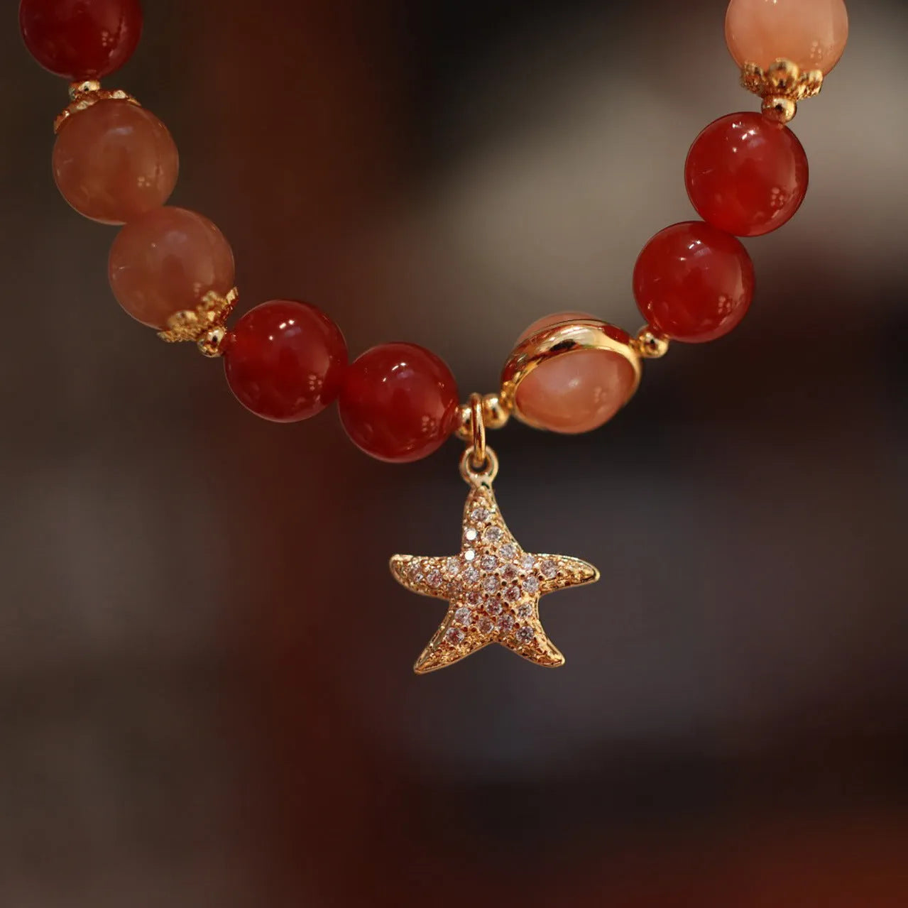 Handmade women's 8mm red agate and sunstone bracelet with xiangyun patterns in ethnic style