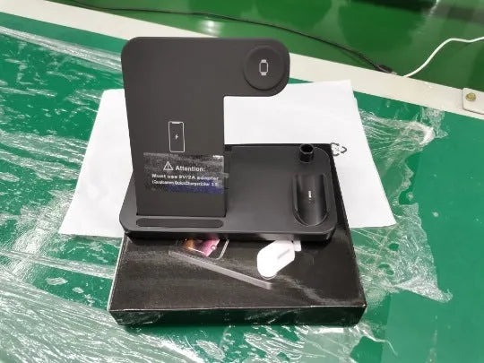 Folding 4-in-1 wireless charger in black, showing vertical stand and charging pads for Apple devices