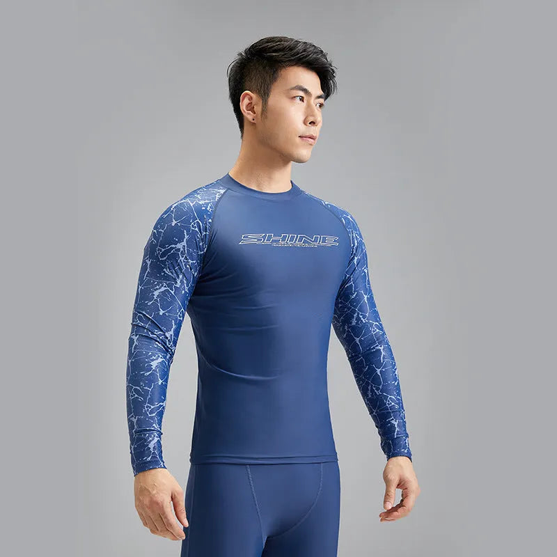 Dark blue men's swimwear set with patterned nylon top and matching swim trunks