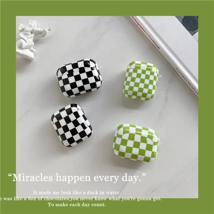 Checkerboard pattern TPU protective case cover for Apple AirPods charging case in black and green.