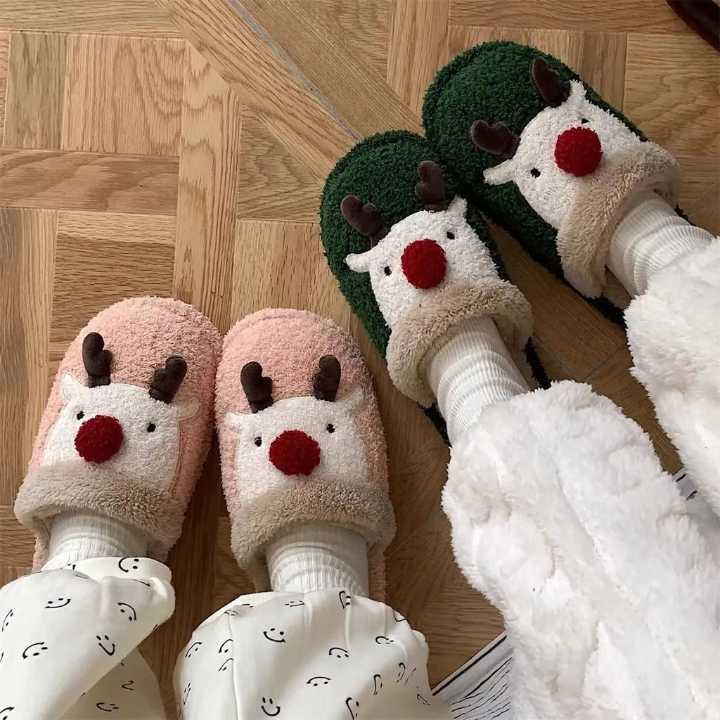 Women's green plush Christmas slippers with an elk design and a non-slip PVC sole.