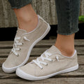 Women's creamy-white casual sneakers with fabric upper and rubber sole, low-top design for versatile wear