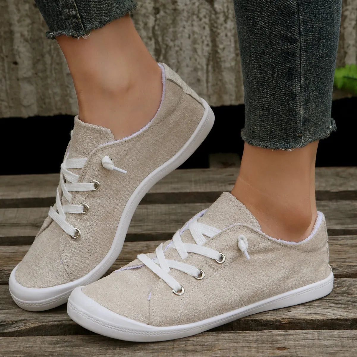 Women's creamy-white casual sneakers with fabric upper and rubber sole, low-top design for versatile wear