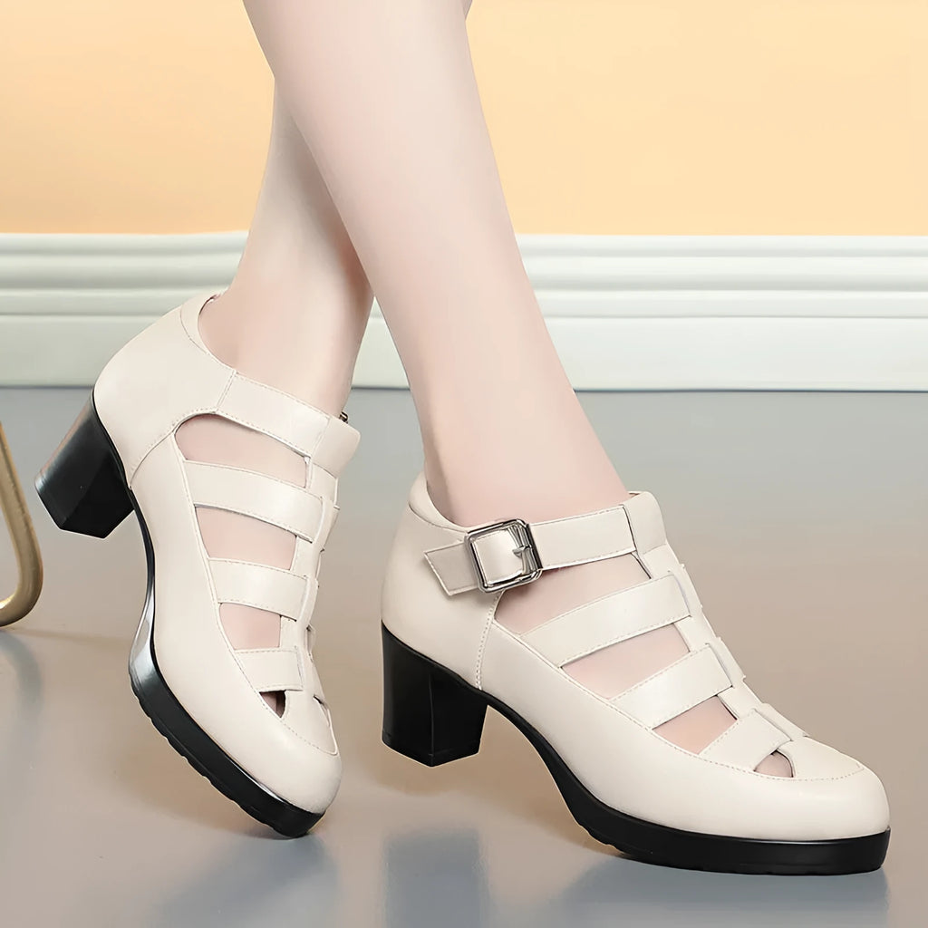 Women's beige closed toe sandals with chunky heel, woven hollowed upper, and ankle strap buckle.