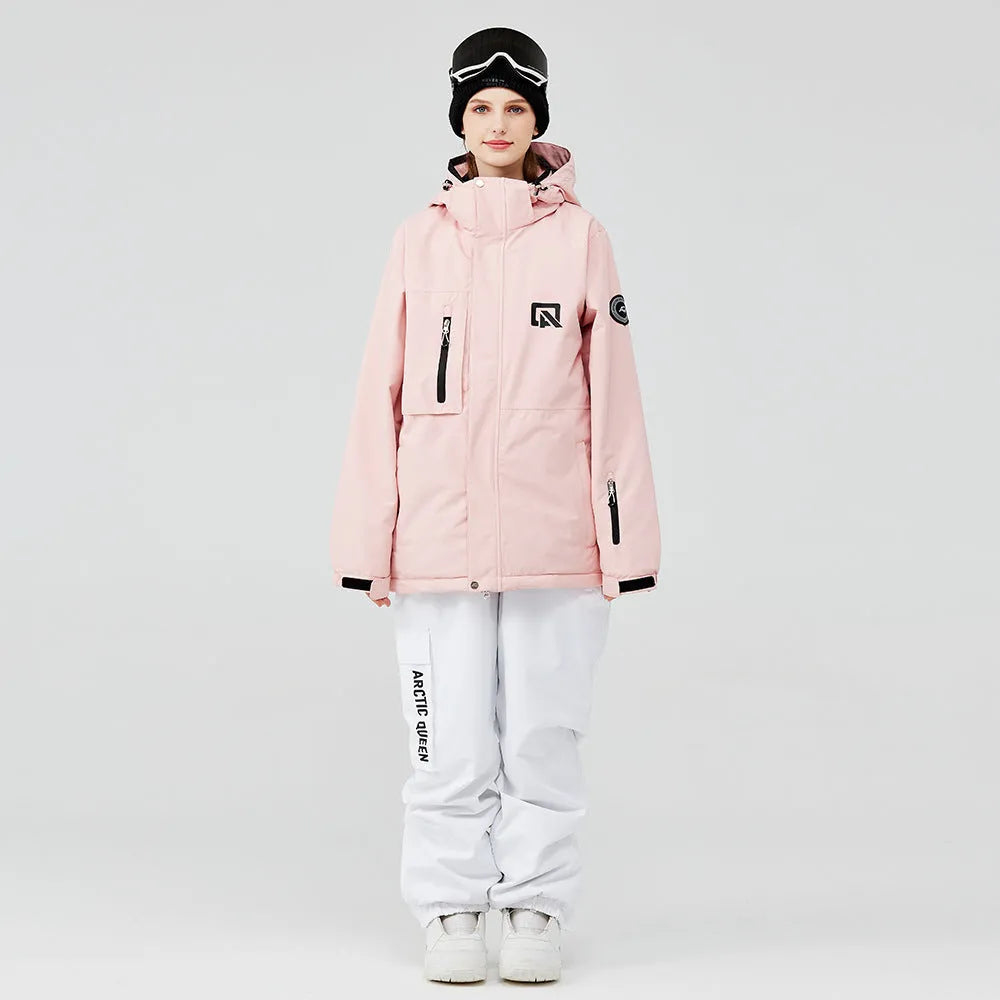 Men's and women's winter ski suit in blue top with grey-blue pants, showing waterproof construction for snow sports