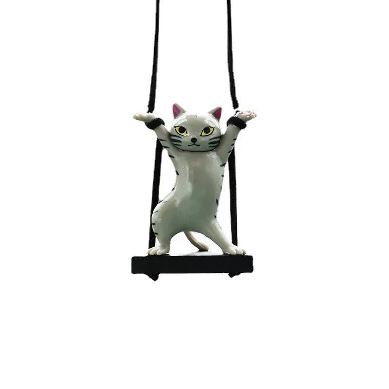 Cartoon-style resin cat pendant for car interior decoration in various colours with adjustable rope.