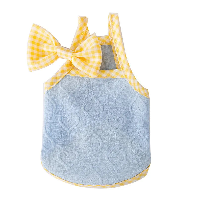 Small dog wearing blue elastic vest with bow suspenders, showing four-sided stretch design for 0.50-10.00kg pets