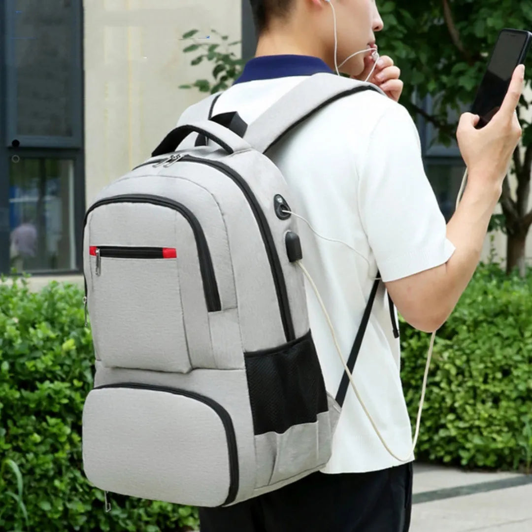 Light grey Oxford cloth backpack with curved shoulder straps showing sewing line details and dry-wet separation compartments