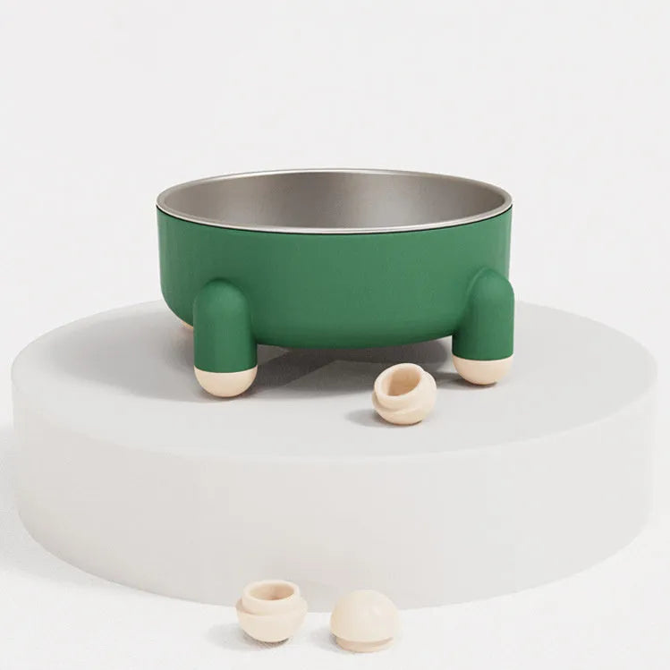 Green stainless steel pet bowl with non-slip base and high foot on a wooden floor.