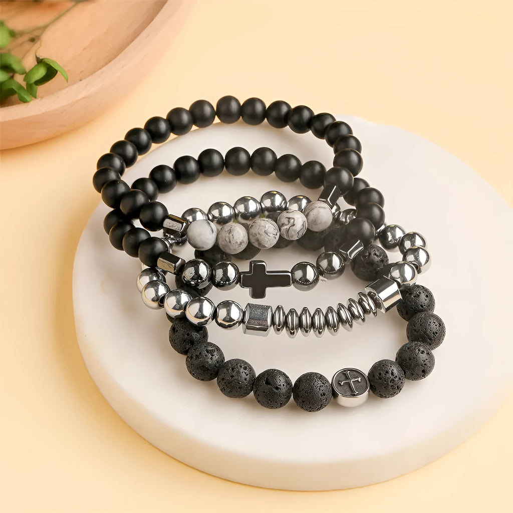 Stainless steel bracelet with 10mm volcanic agate beads and 19mm geometric clasp on a wrist