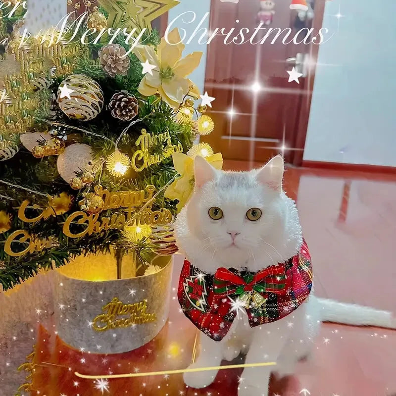 Polyester pet scarf with festive snowflake and bell designs in multiple sizes for winter and holiday use.