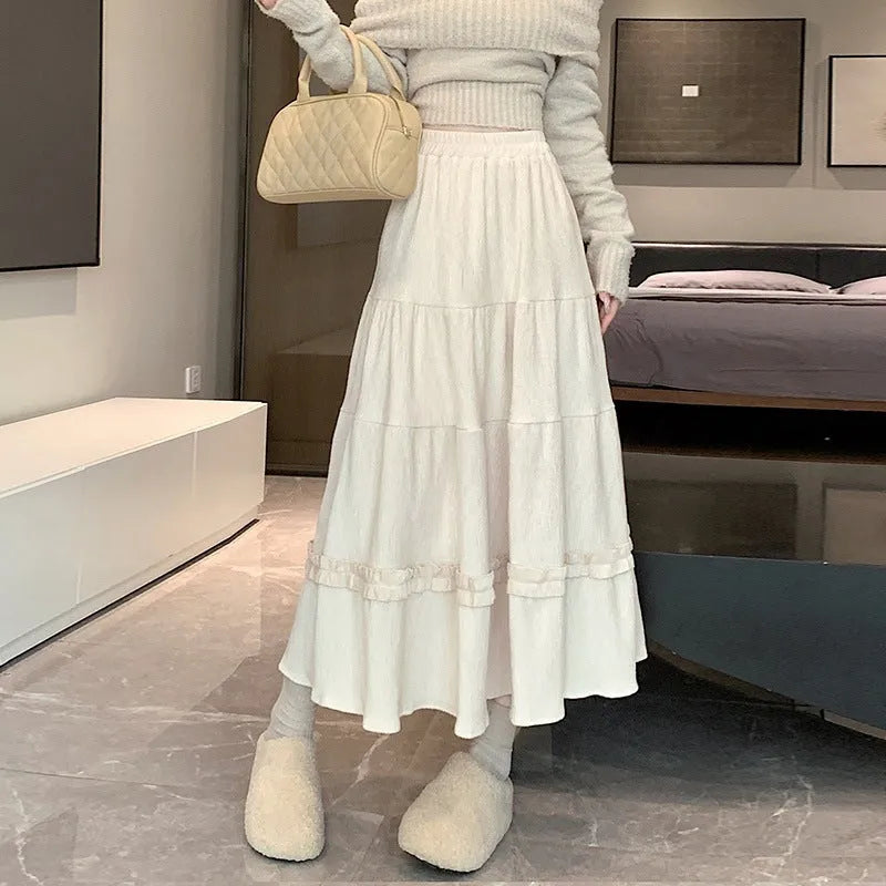 A-line corduroy midi skirt with elastic waistband in milky white colour showing 70cm length and ribbed fabric texture