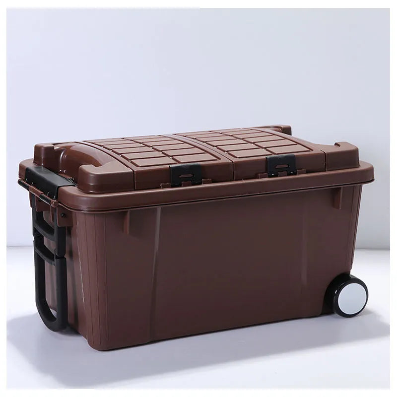 Large orange plastic storage box with pull-out handle and wheels, showing 55L capacity and double-seal lid.