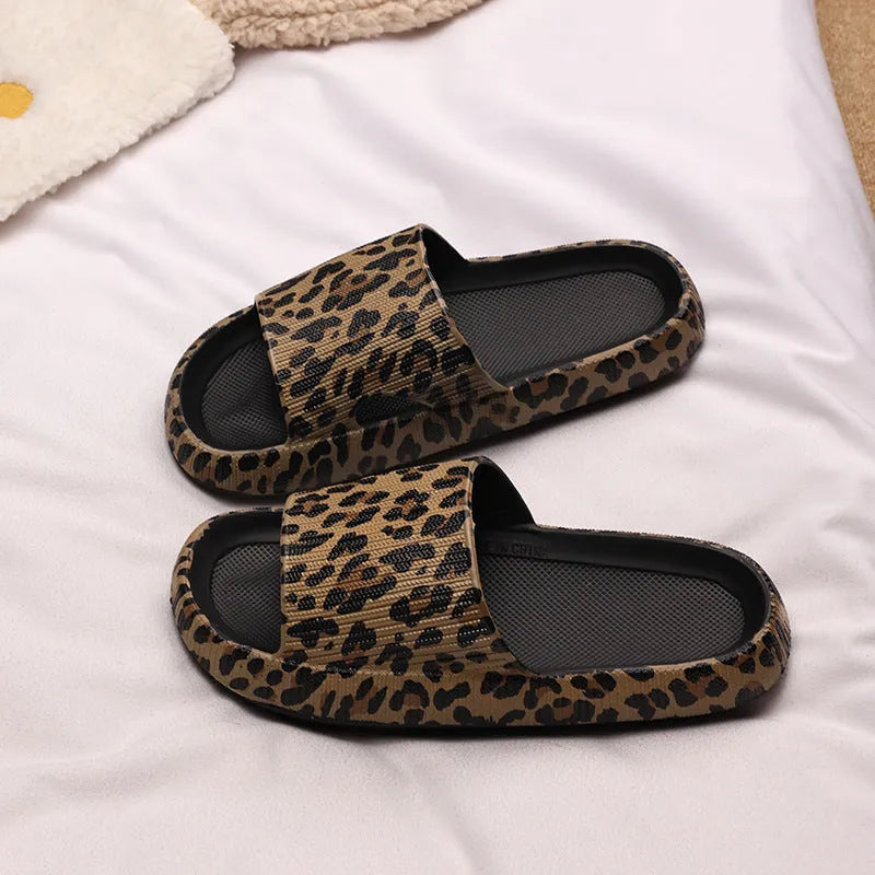 Leopard print slippers with thick EVA sole showing slip-on design and animal pattern details