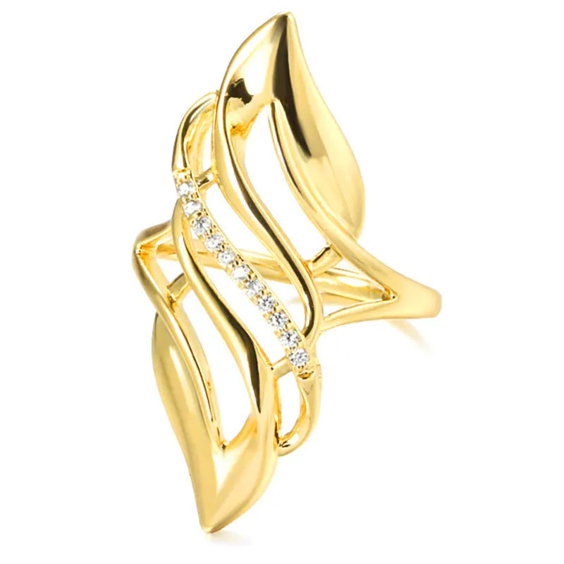 Women's exaggerated curve ring in Q611 gold colour on copper with casual styling