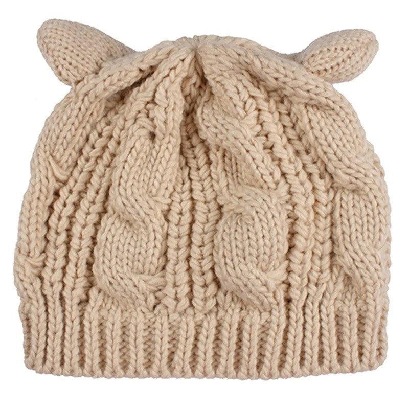 Hand-knitted wool cat ear beanie in red colour showing 3D ear design and textured wool material