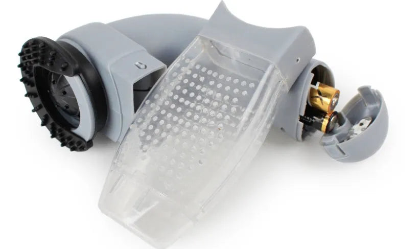 Grey portable pet hair vacuum cleaner and massage brush for dog and cat grooming on sofa