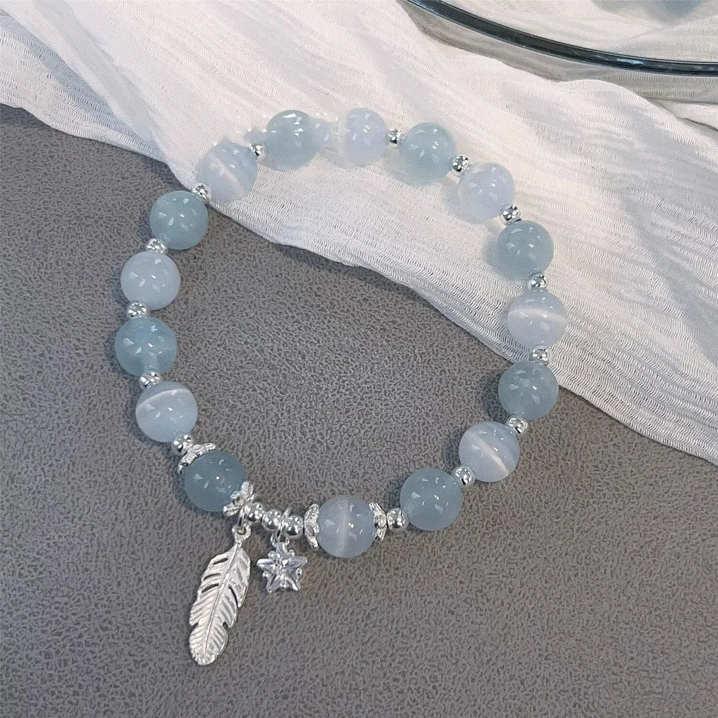 Korean style glass bracelet with feather XINGX blue moonlight colour and eight Awn star decorative elements