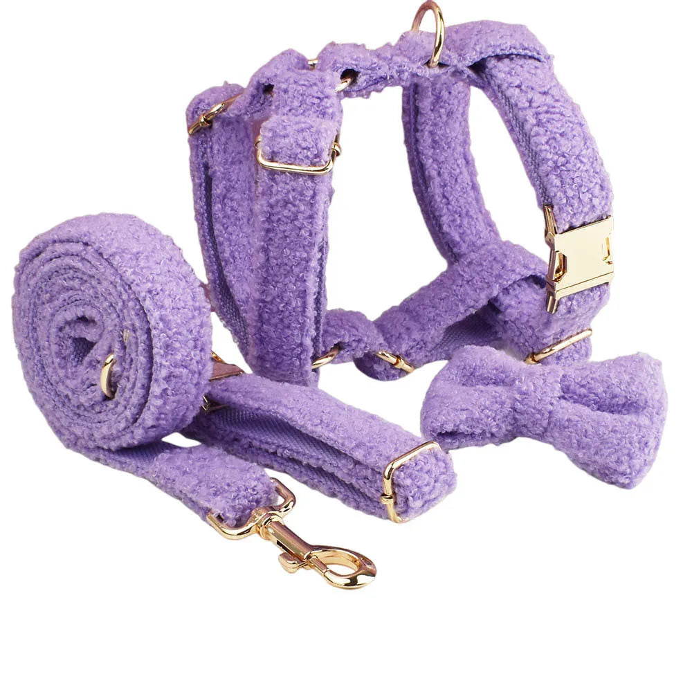 Four-piece cloth dog set showing collar, leash, bow, and vest for small to extra large dogs