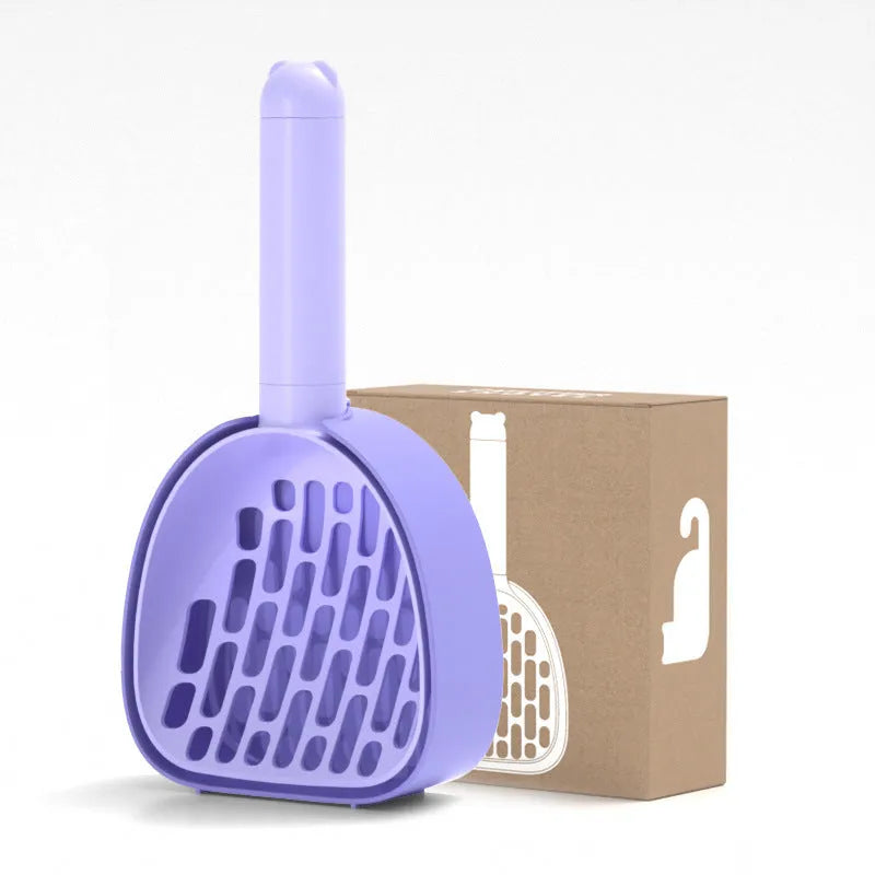 White ABS plastic cat litter scoop standing on a matching storage base with integrated waste bag roll.