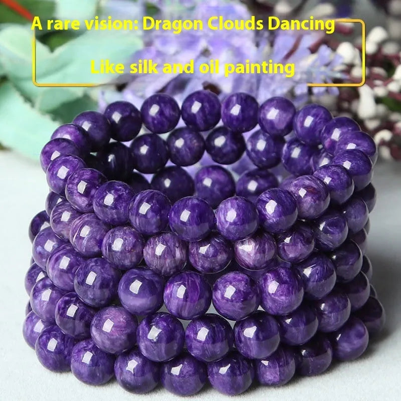 Natural transparent charoite crystal bracelet with platinum beads in 6mm, 8mm, 10mm, and 12mm sizes on wrist