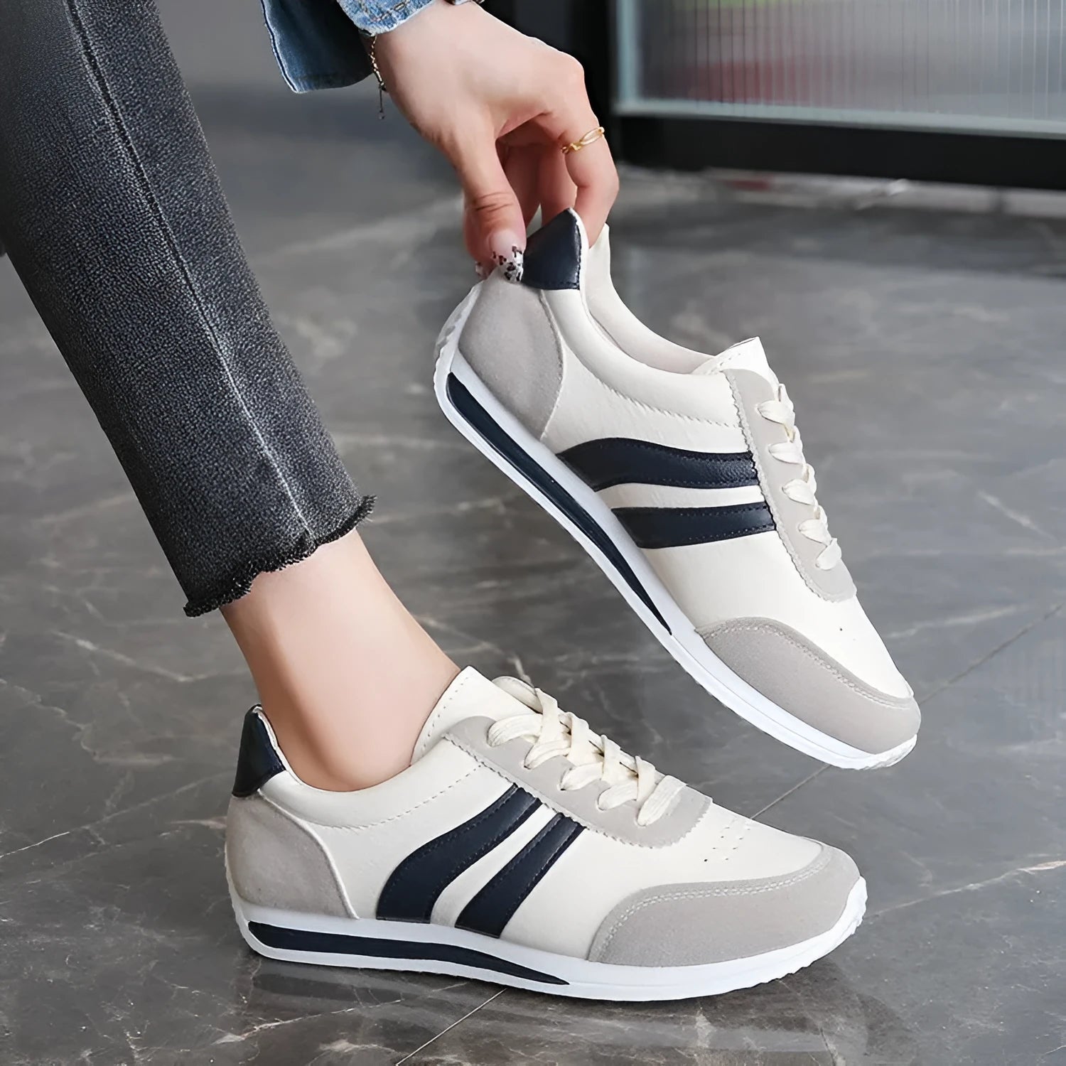 Blue and red low-top lace-up running sneakers with a round toe and rubber sole